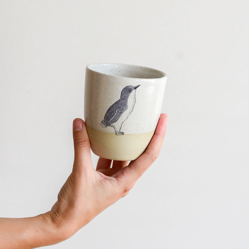 Australian Souvenirs Online A Handmade Penguin Ceramic Cup by Renee Treml and Kim Wallace