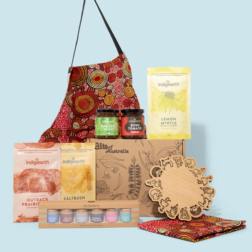 Australian made gift hamper with Aboriginal art apron and tea towel, native Australian foods, spices, jam, chutney and trivet
